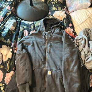 Carhartt Fleeced Sweatshirt. Doesn’t have the full middle zipper.